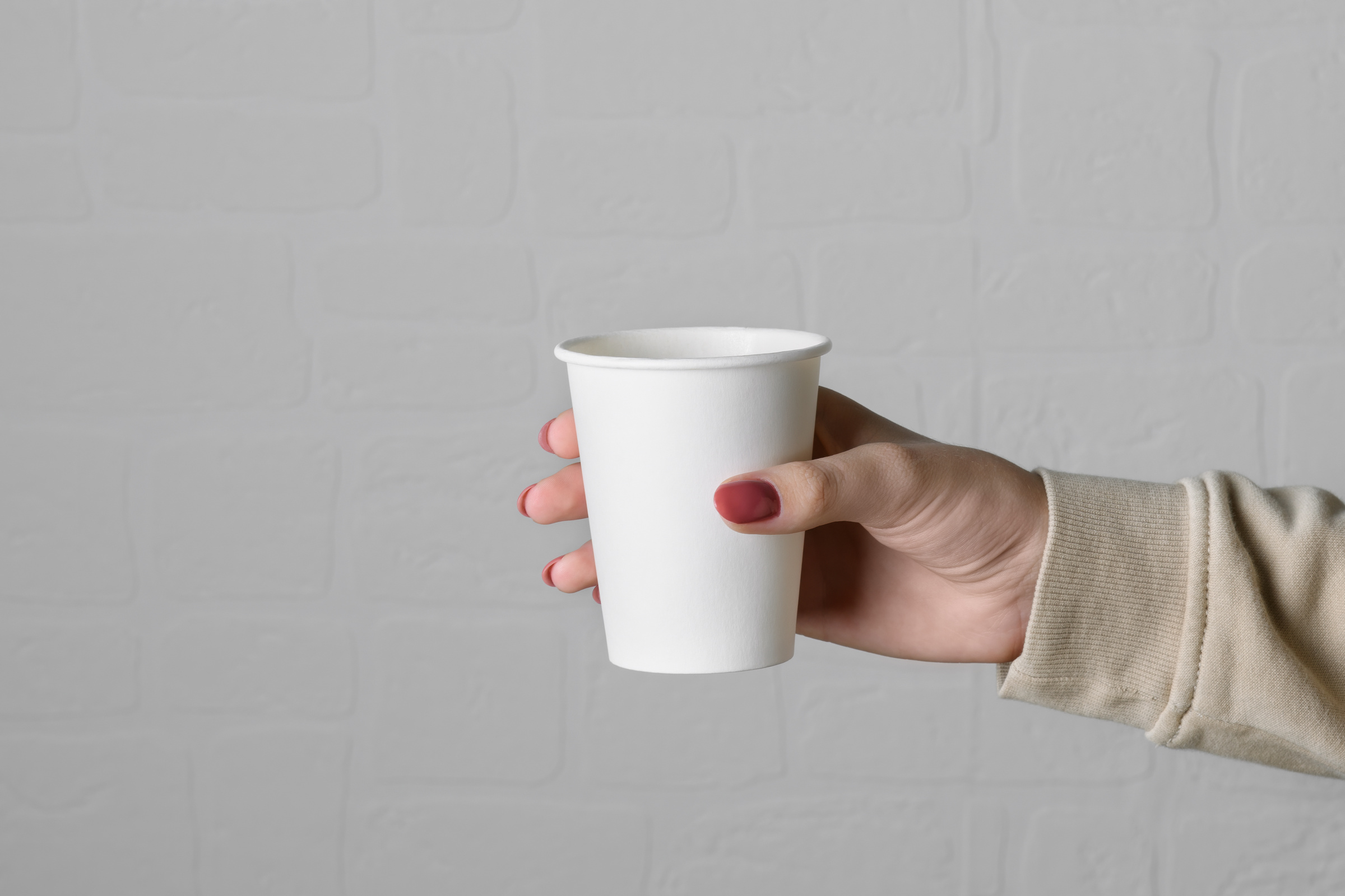 Person Holding Paper Cup 