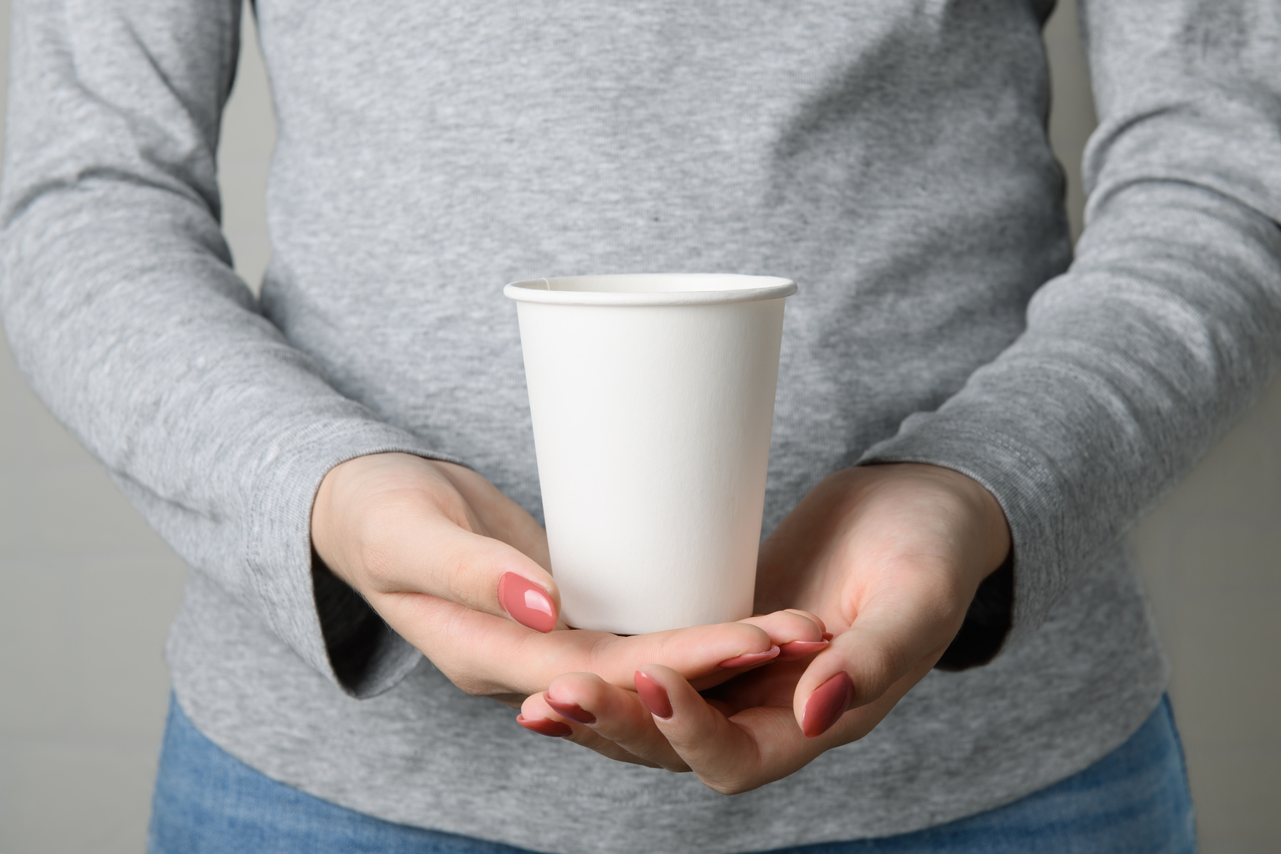 Person Holding Paper Cup 